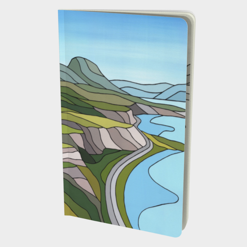 Front cover of notebook depicting geometric print of mountain and Okanagan lake