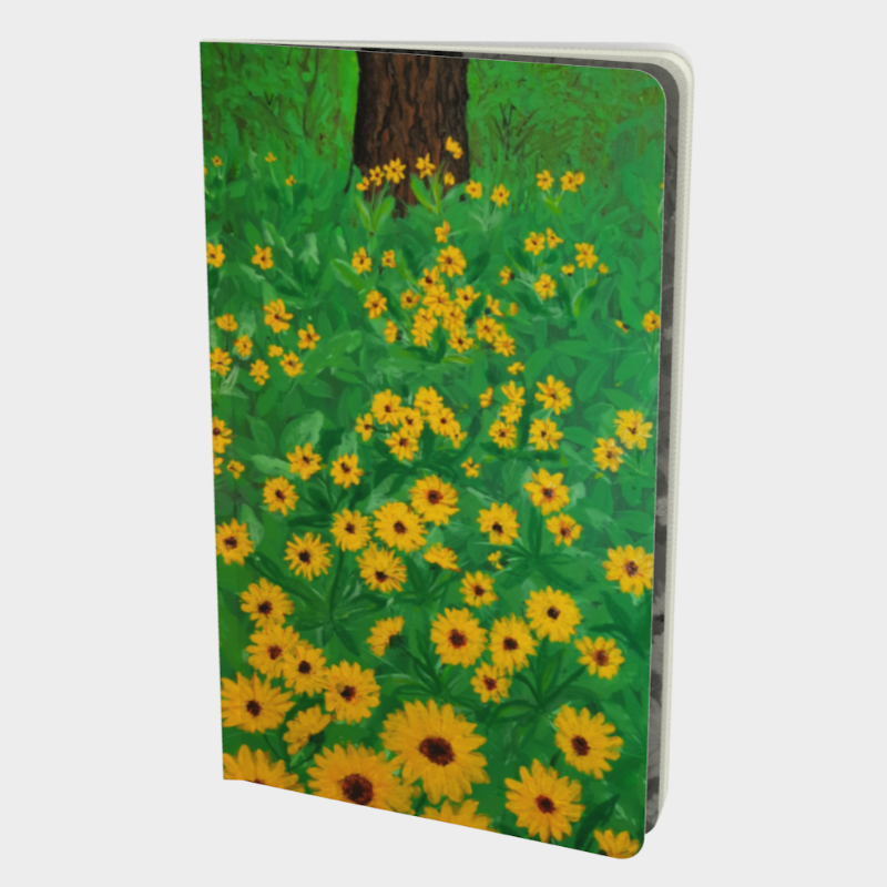 Front cover of notebook depicting print of painting of tree trunk surrounded by grass and yellow flowers