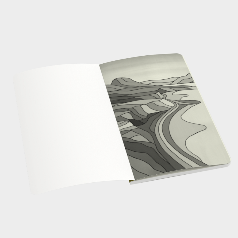 Open notebook with first page depicting black and white geometric print of Okanagan lake and mountain