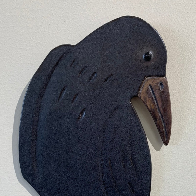 Detail of black crow wall hanging
