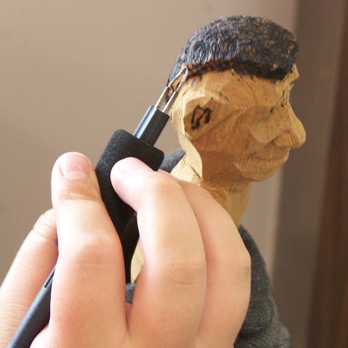 Person doing woodburning