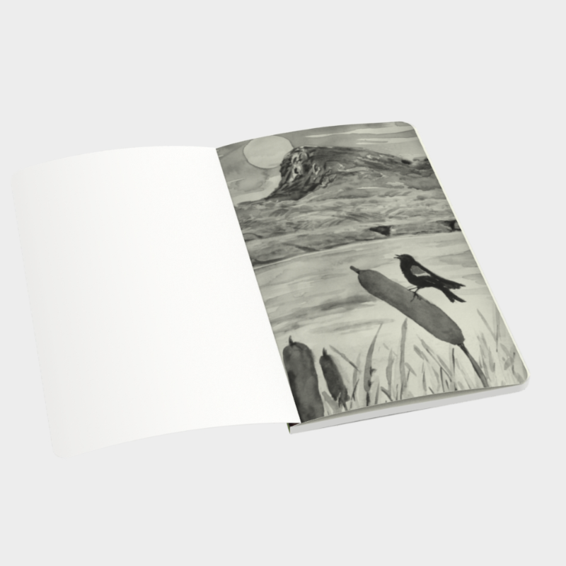 Open notebook depicting black and white print of watercolour painting of Giant&#39;s Head Mountain and meadowlark