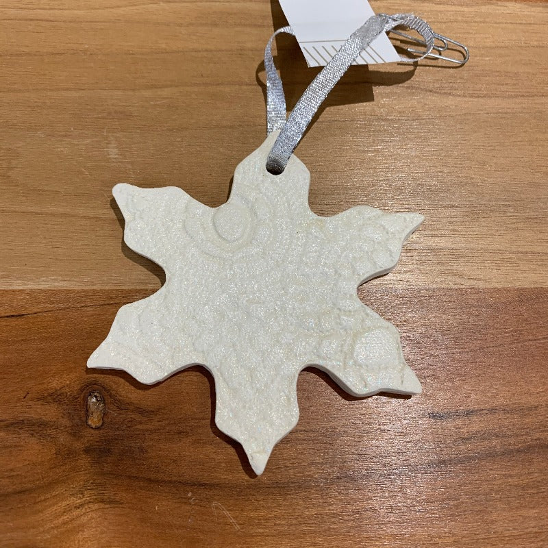 White clay ceramic Christmas ornament with lace imprint