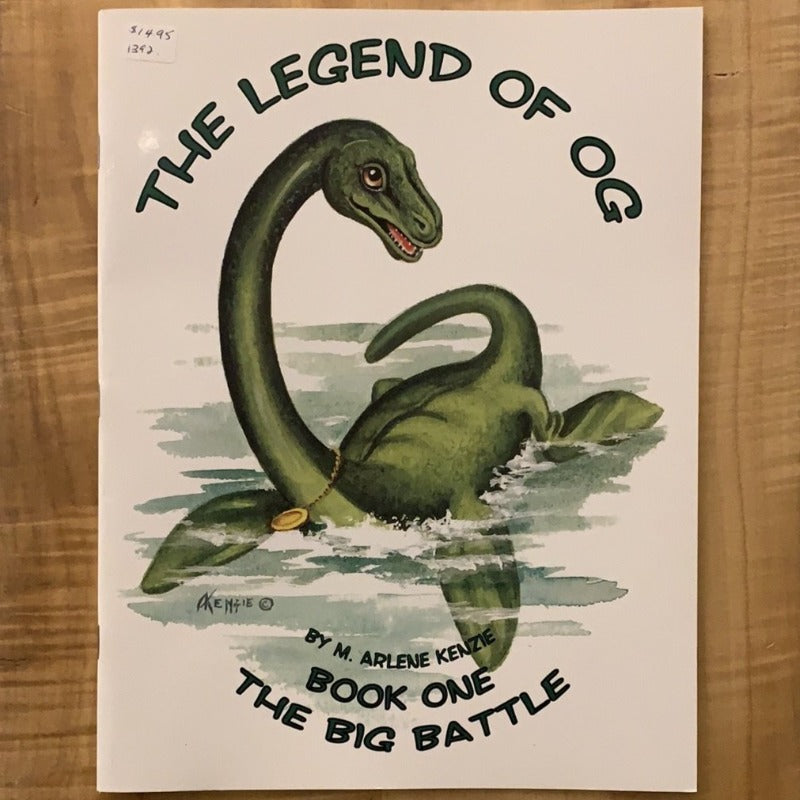 Cover of children&#39;s book &quot;The Legend of Og&quot; depicting a large green Ogopogo with a medallion around its neck