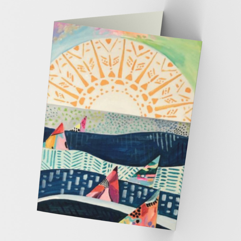 Stationery card featuring print of sun and sailboats on lake